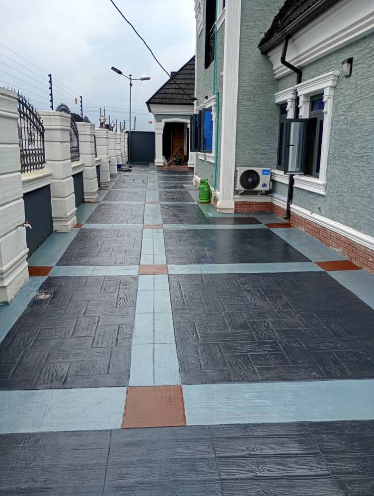 Slate stamped concrete walkway with coloured borders